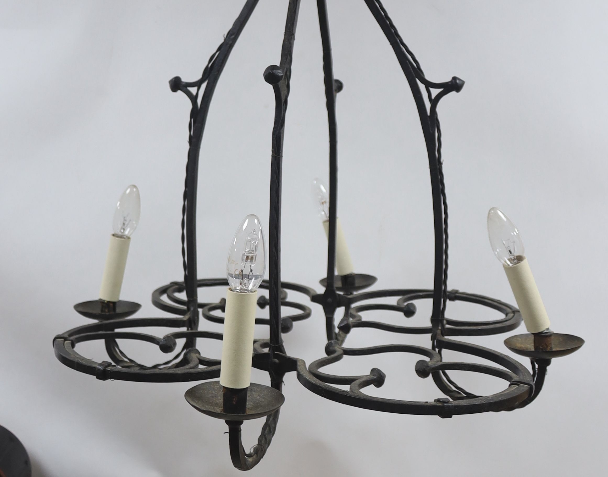 A wrought iron 4 light chandelier 80x63cm